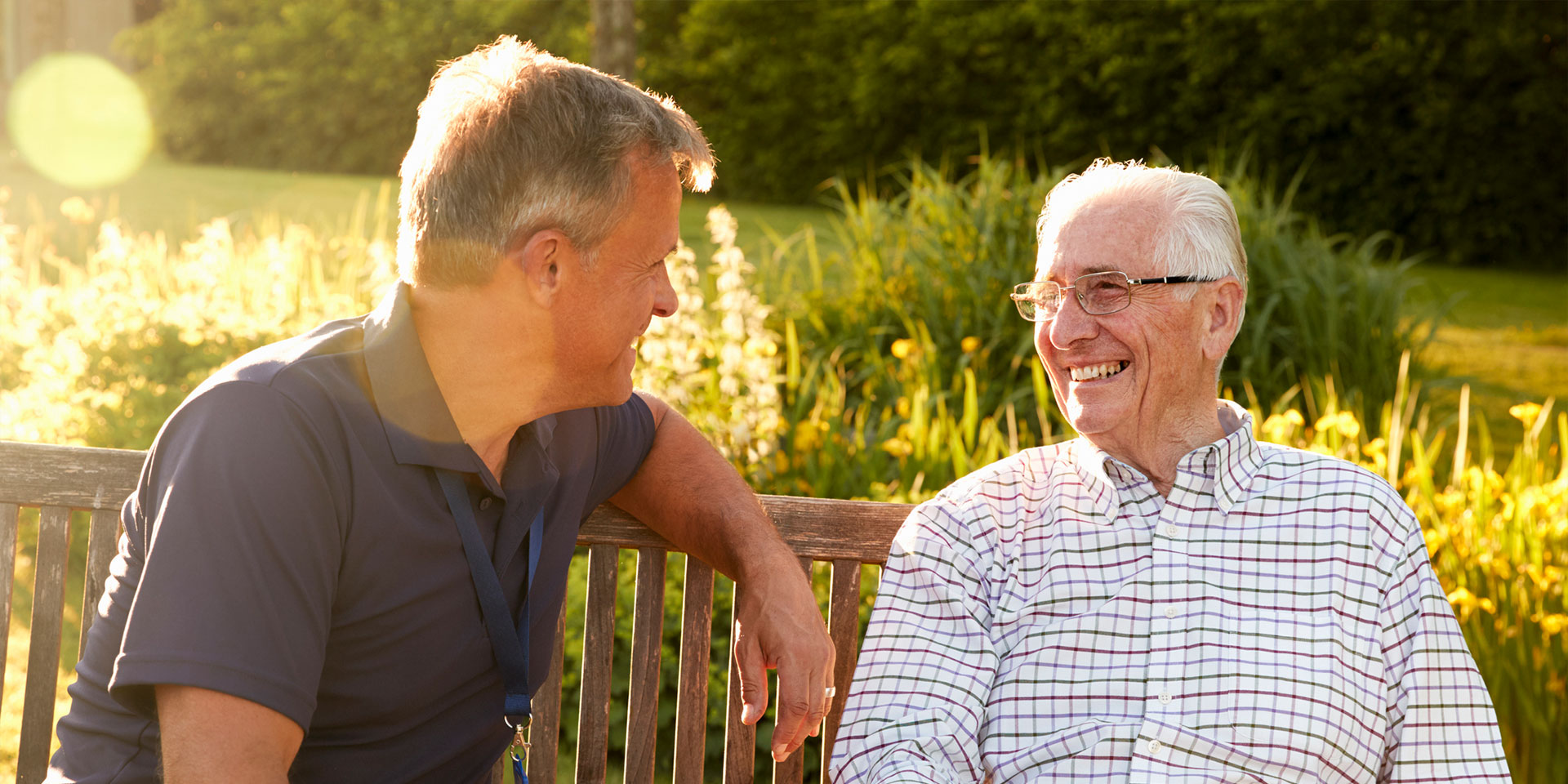 Two men chatting on a bench