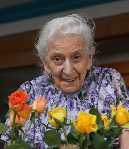 Resident at Russell Churcher Trust smiling.