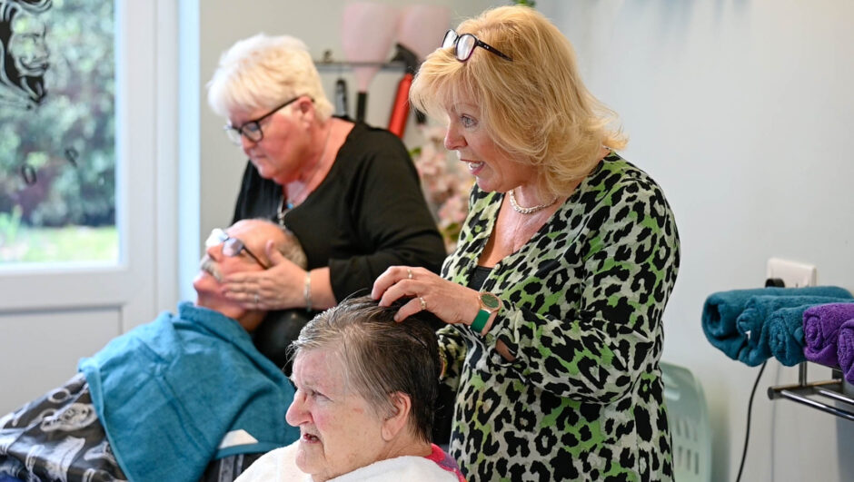 Residents in the salon at Russell Churcher Court care home.